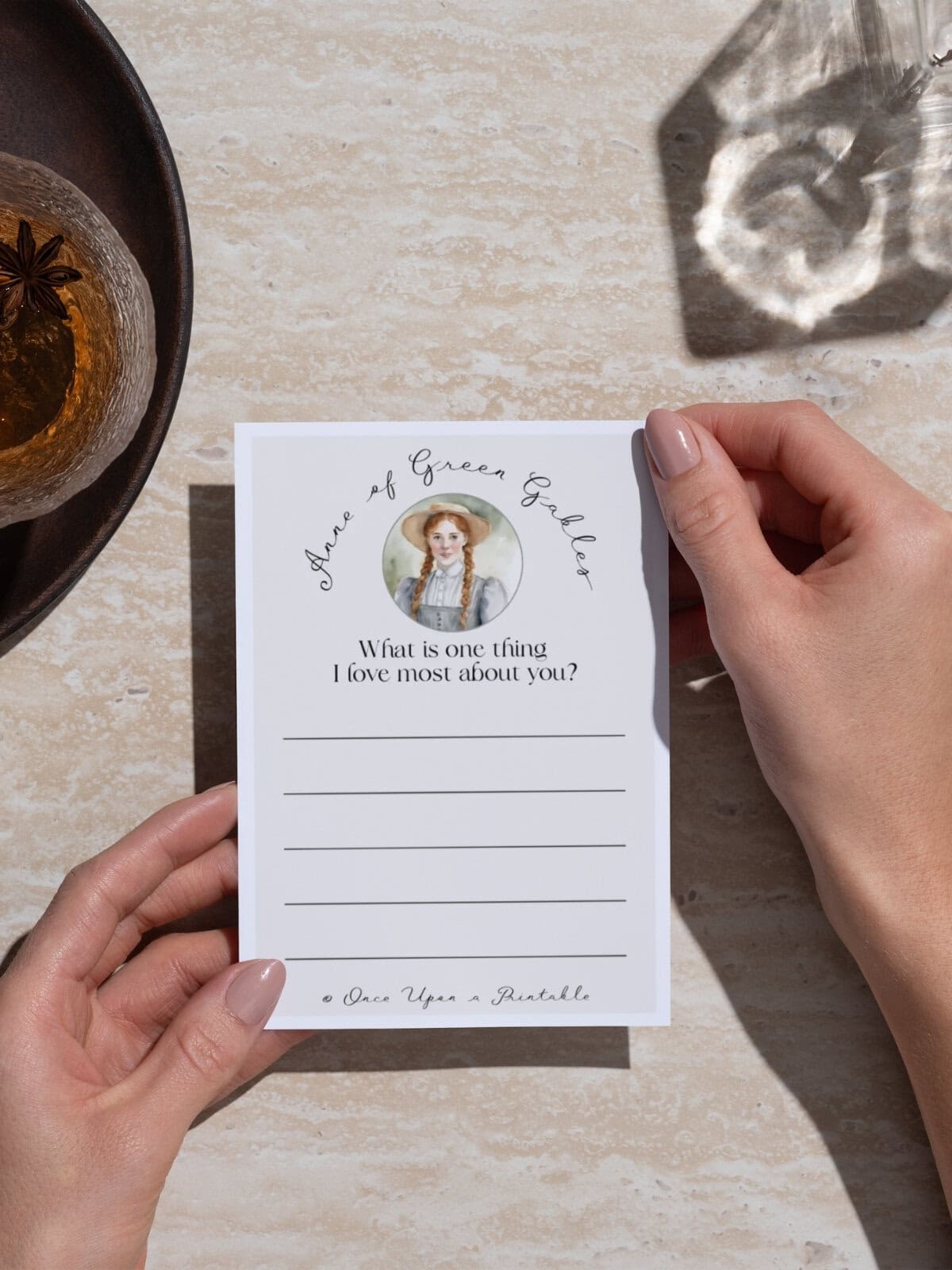 Anne of green gables friendship note held in a woman's hand.
