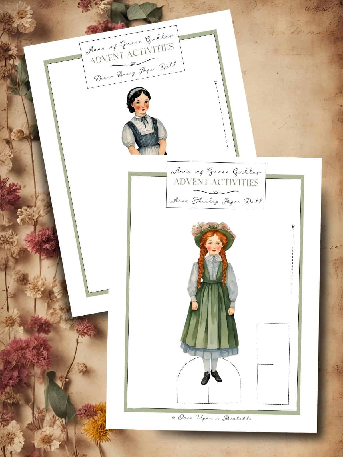 Anne of Green Gables paper dolls laying on a brown paper background with dried flowers.