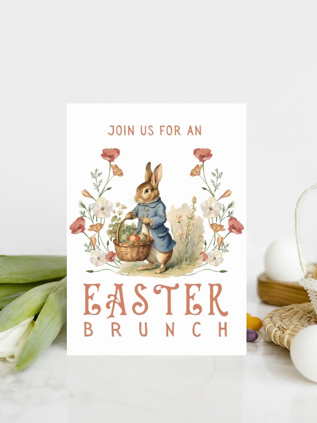 Easter brunch invitation card with peter rabbit laying with some eggs and tulips.