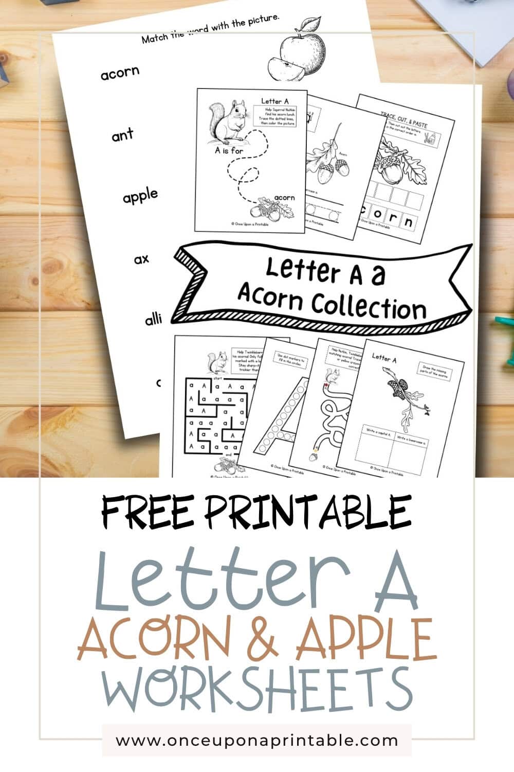 Letter A unit study worksheets with word and picture matching game laying on a wooden surface with coloring pencils.