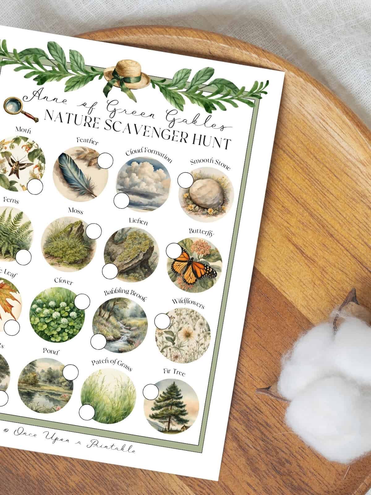 Anne of green Gables inspired nature scavenger hunt sitting on a wooden lazy susan with a cotton puff.