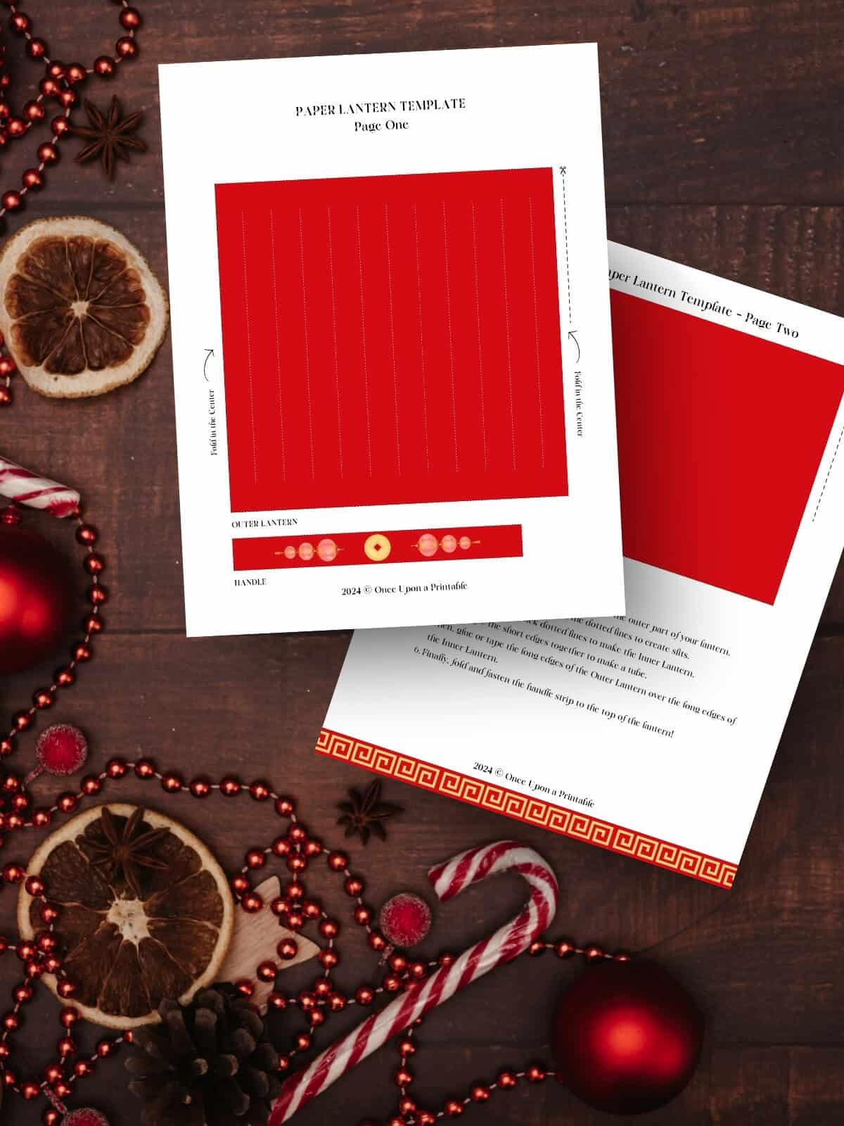 red lantern template for the lunar new year laying on a dark wooden background with peppermints and red ornaments.