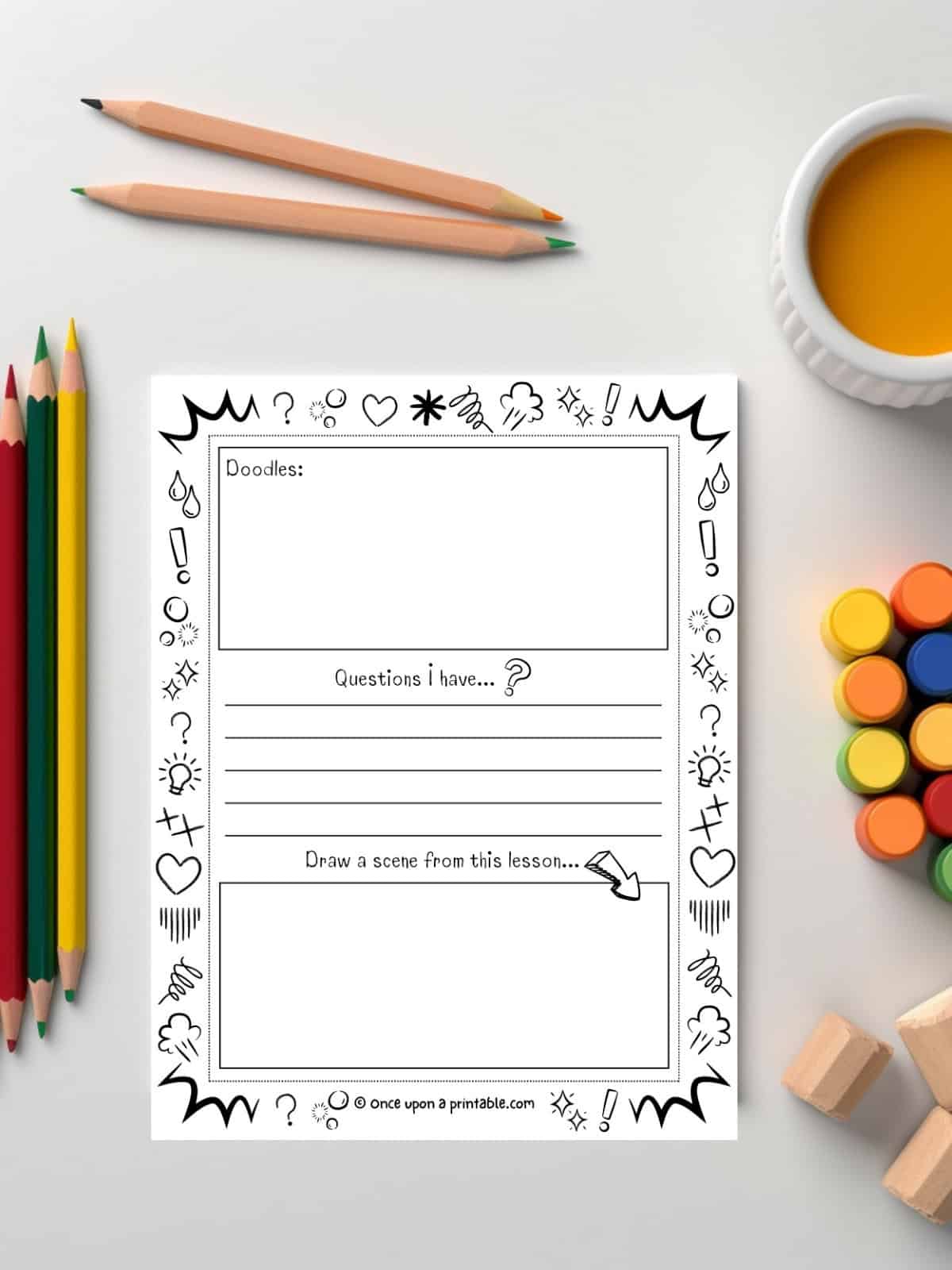 Sermon notes for kids with engaging sections and doodles to color laying on a white table with coloring pencils and paint.