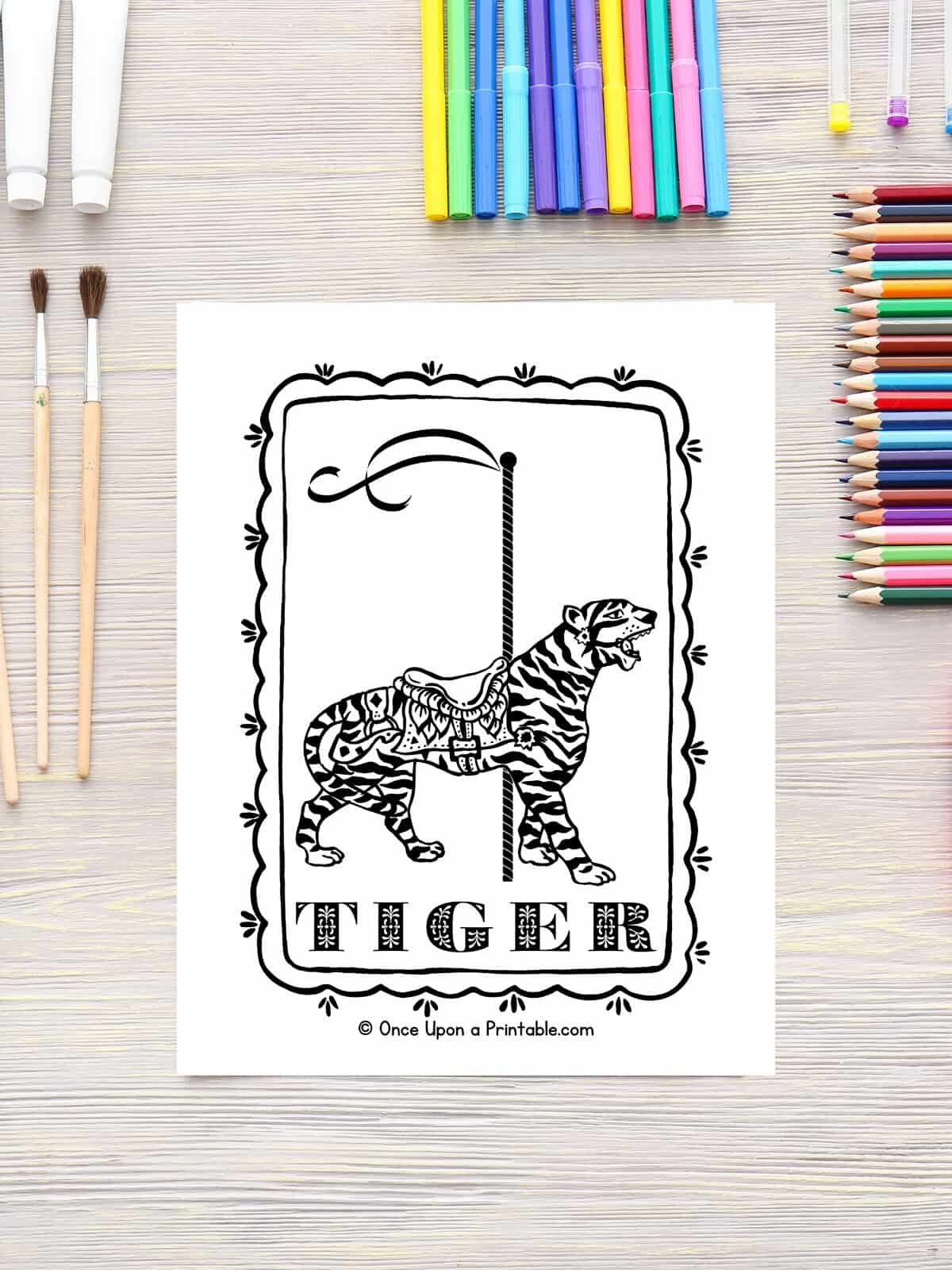 Tiger carousel zoo animal coloring page laying on a table with coloring pages.
