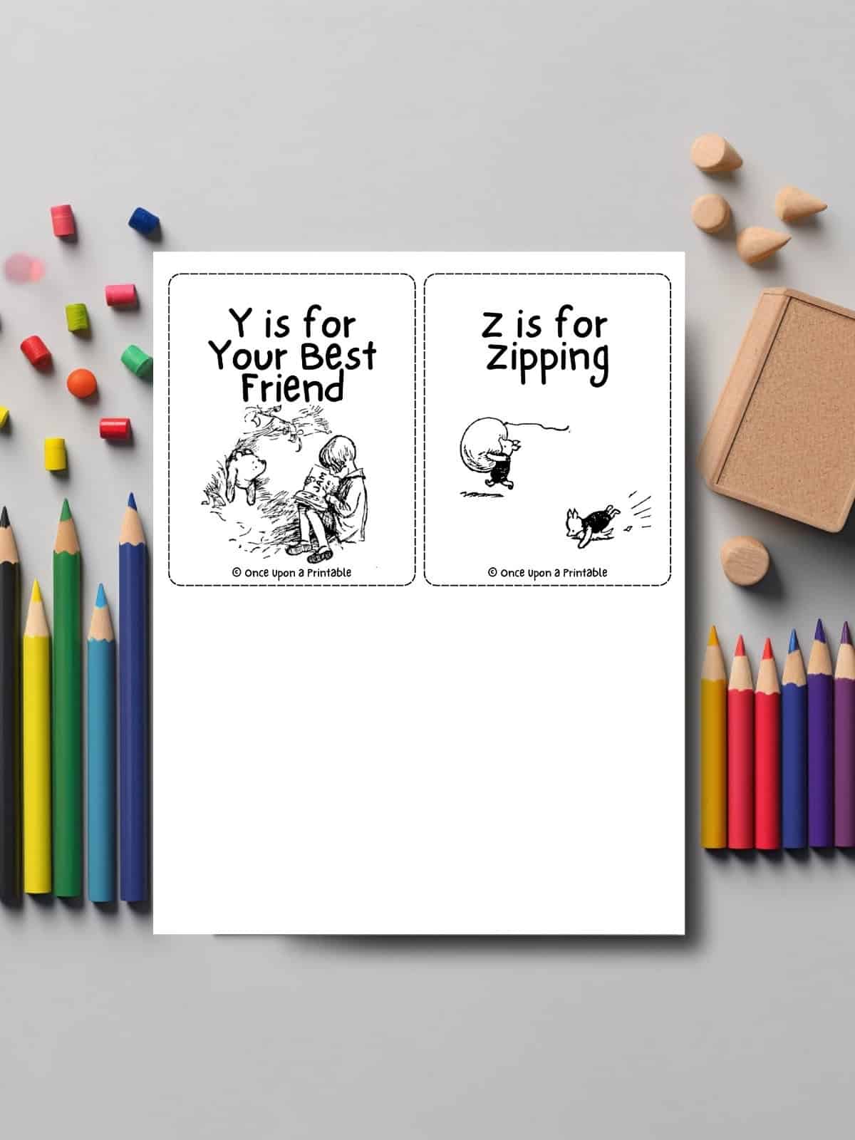 The last of the alphabet flashcards with Y and Z laying on a table with coloring pencils.