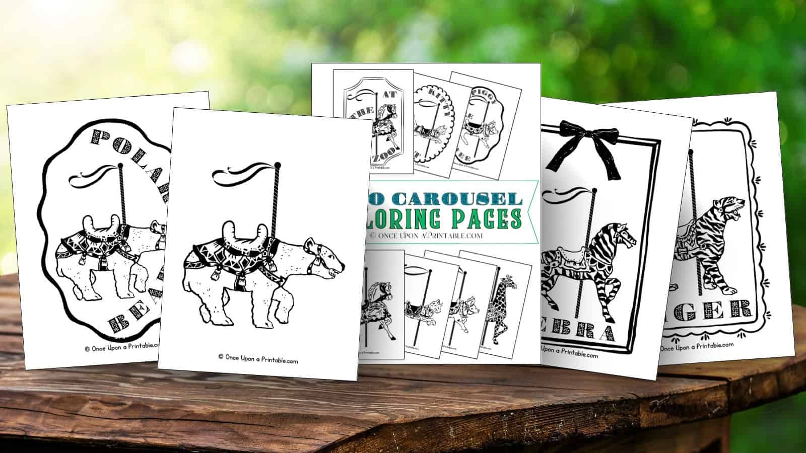 Zoo animal carousel coloring pages laying on a wooden table.