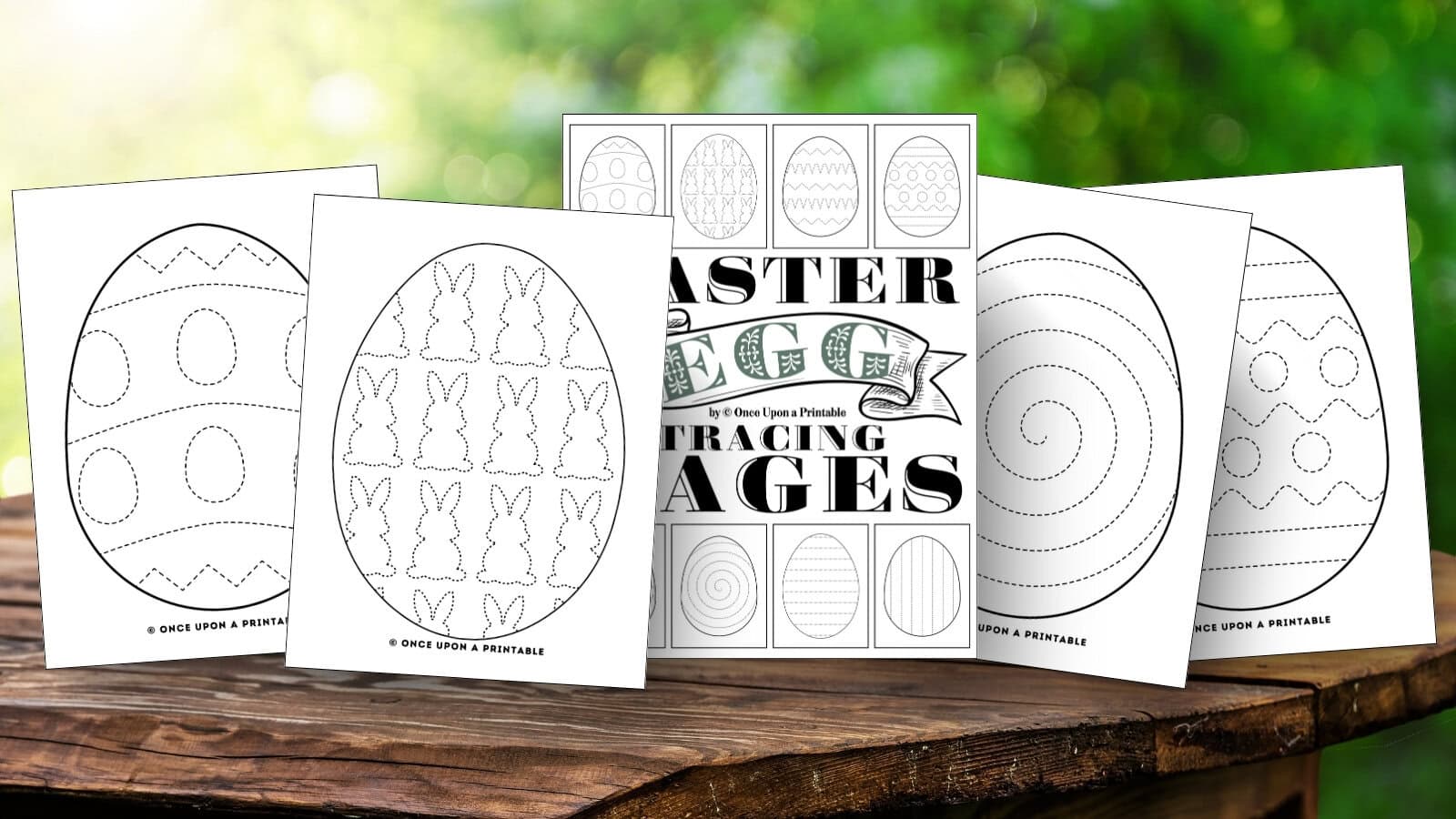 Easter egg tracing pages laying on a wooden table. 