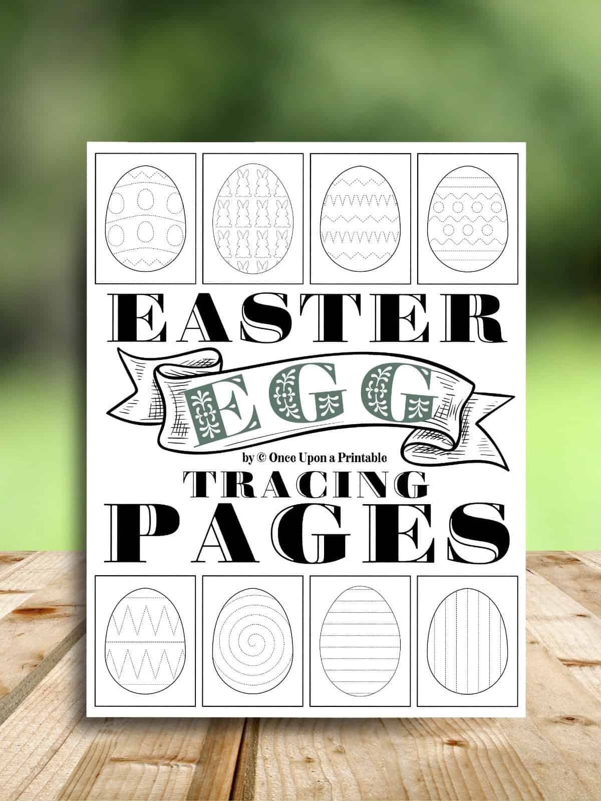 Easter egg tracing worksheets cover page laying on a wooden table.