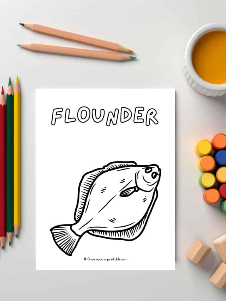 F is for Flounder animal coloring pages laying on a white table with coloring supplies and paints. 