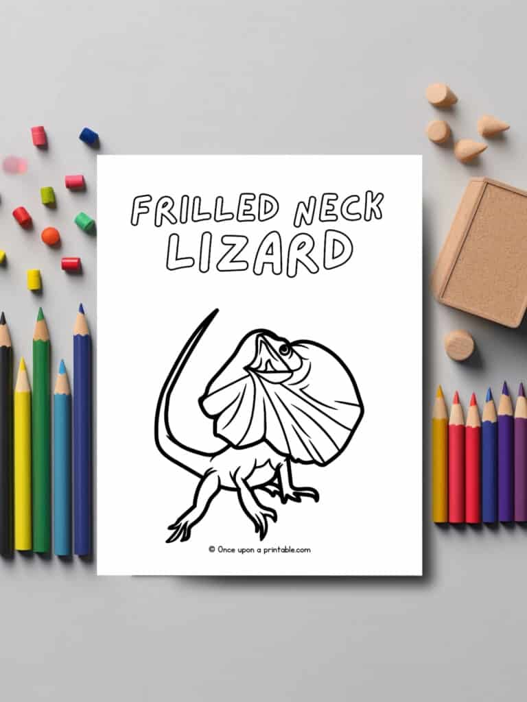 F is for Frilled neck Lizard animal coloring page laying on a table with coloring pencils. 