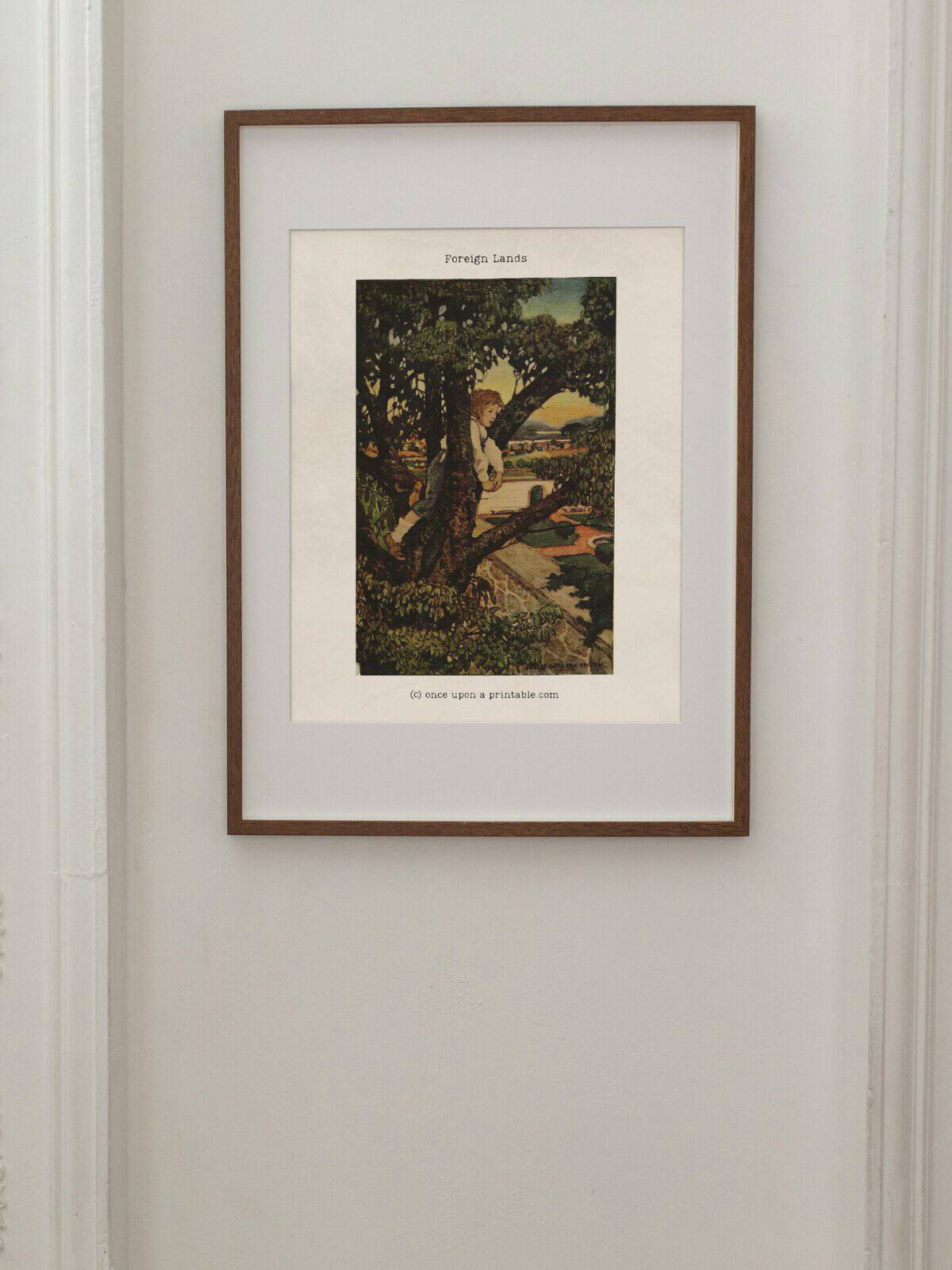 Full page illustration in color by Jessie willcox smith "foreign lands" framed and displayed on the wall.