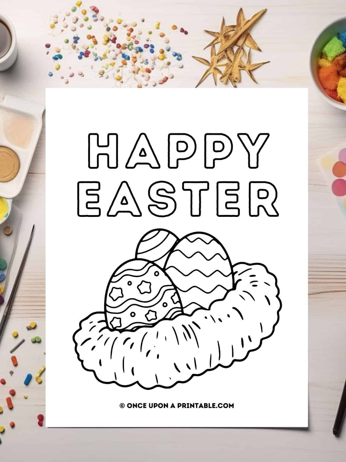 Happy Easter little kid Easter egg coloring page nest laying on a table with coloring supplies.
