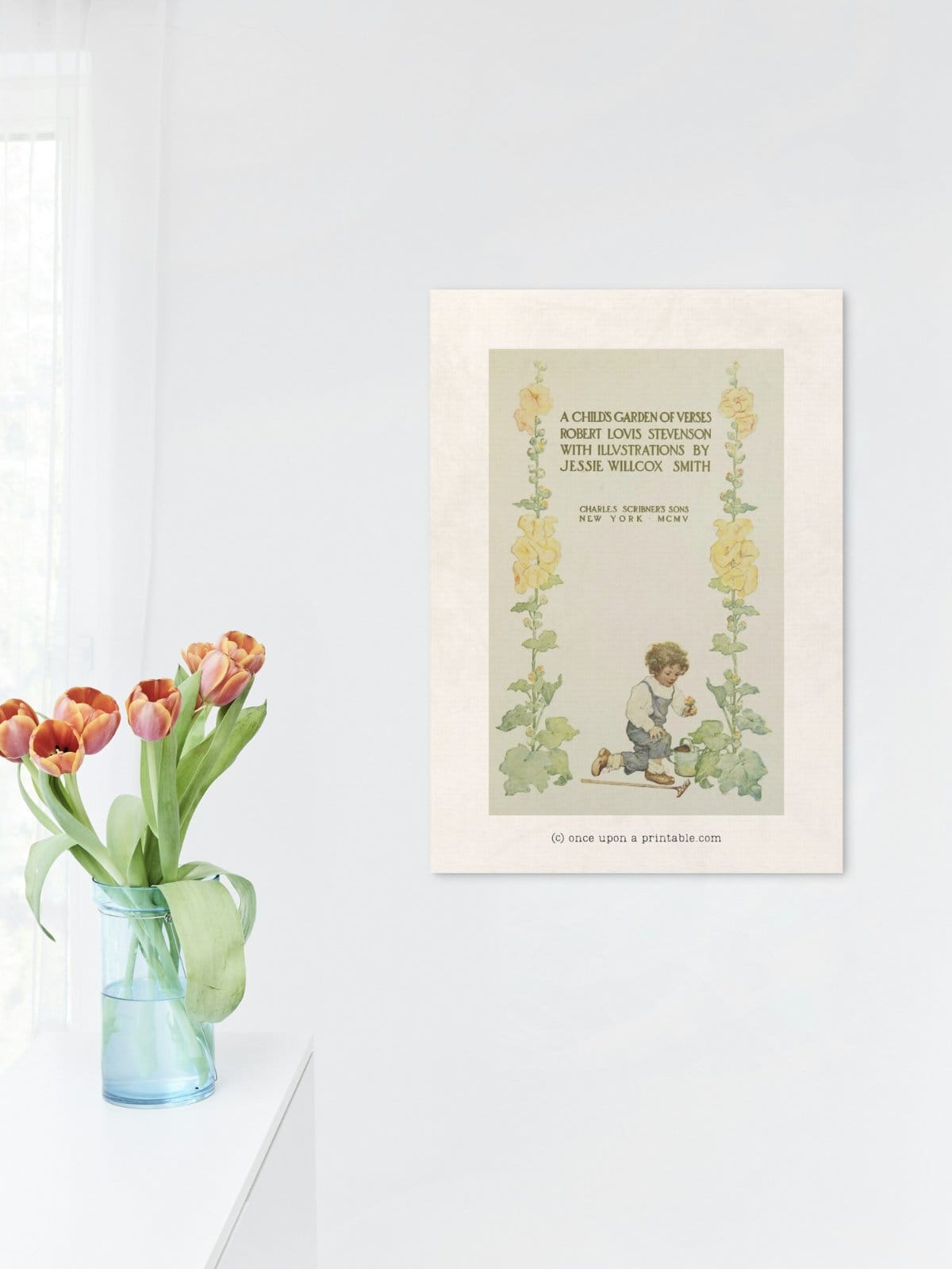 The beautifully calm watercolor illustration opening page of the book of poems "a child's garden of verses" by robert louise stevenson, framed on a wall in the kitchen.