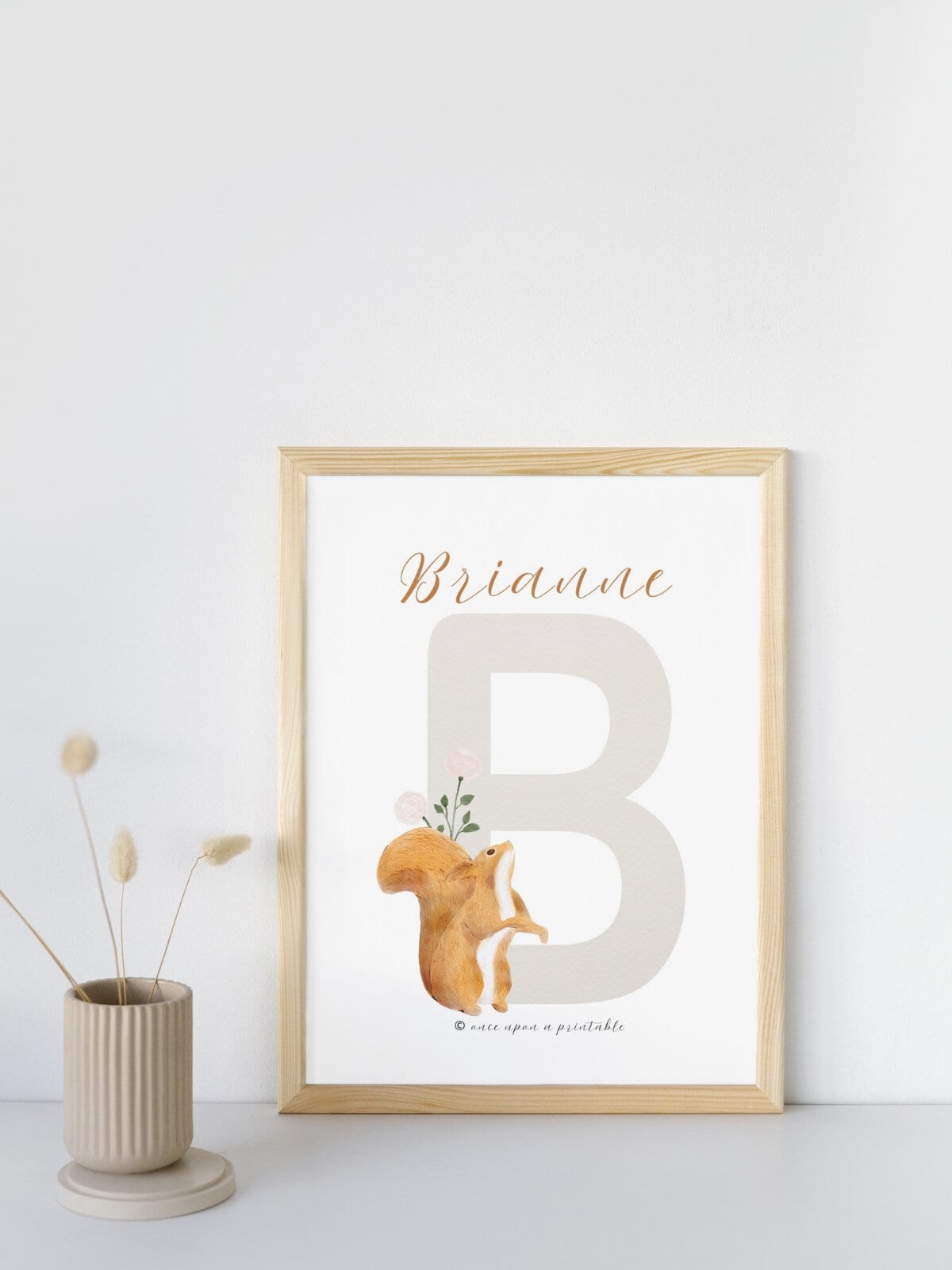 Woodland animal letter B with a name framed on display. 