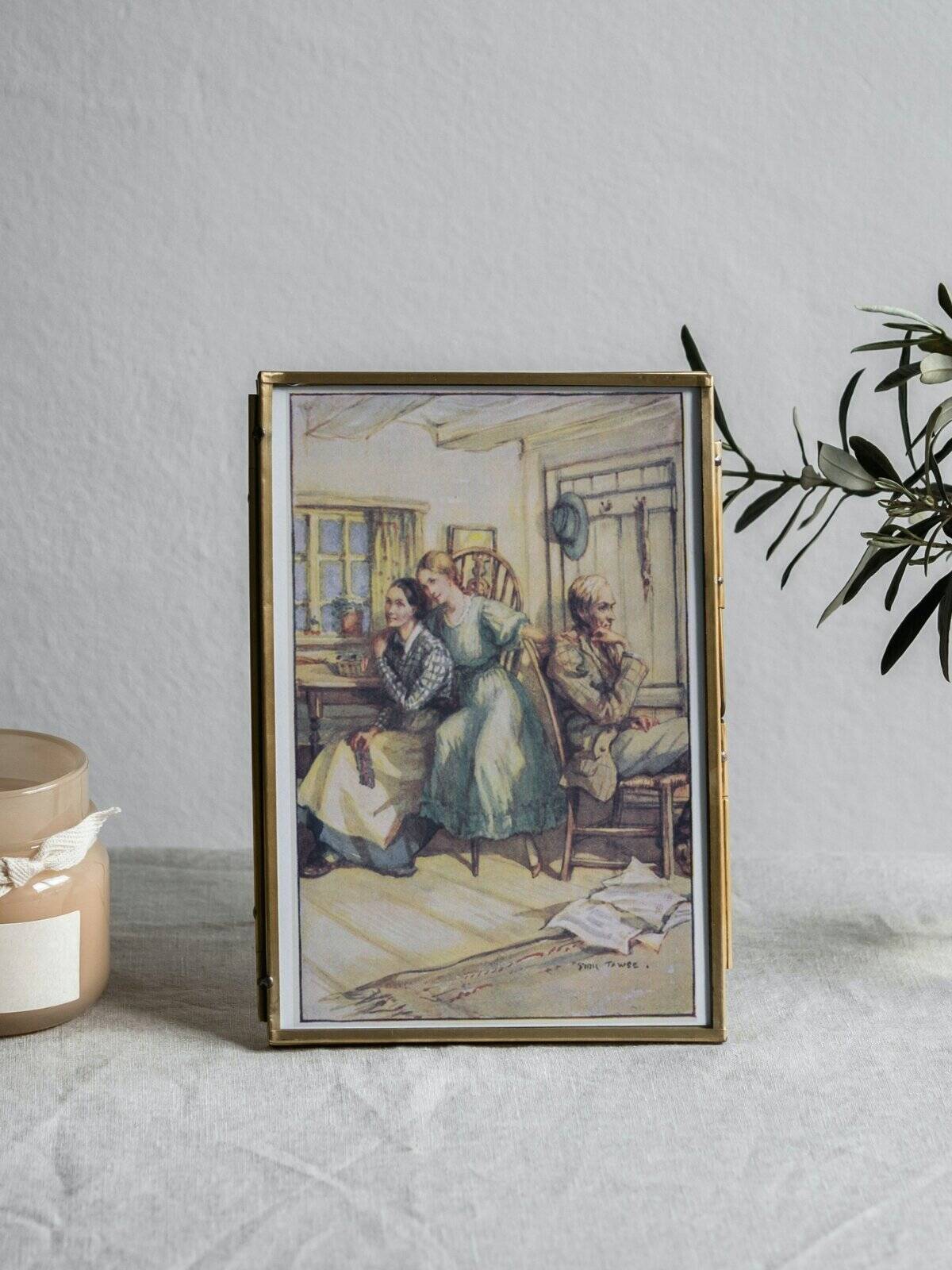 Anne, Marilla, and Matthew illustrated art print in a frame.