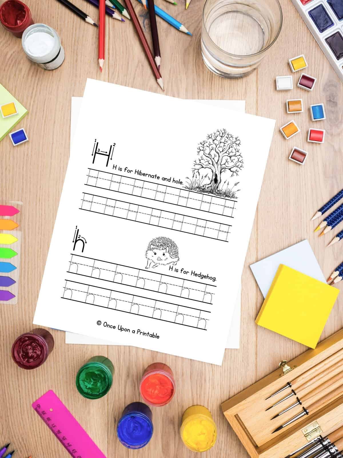 Letter H capital and lowercase letter practice with a hedgehog and their home, a hole in a tree. 