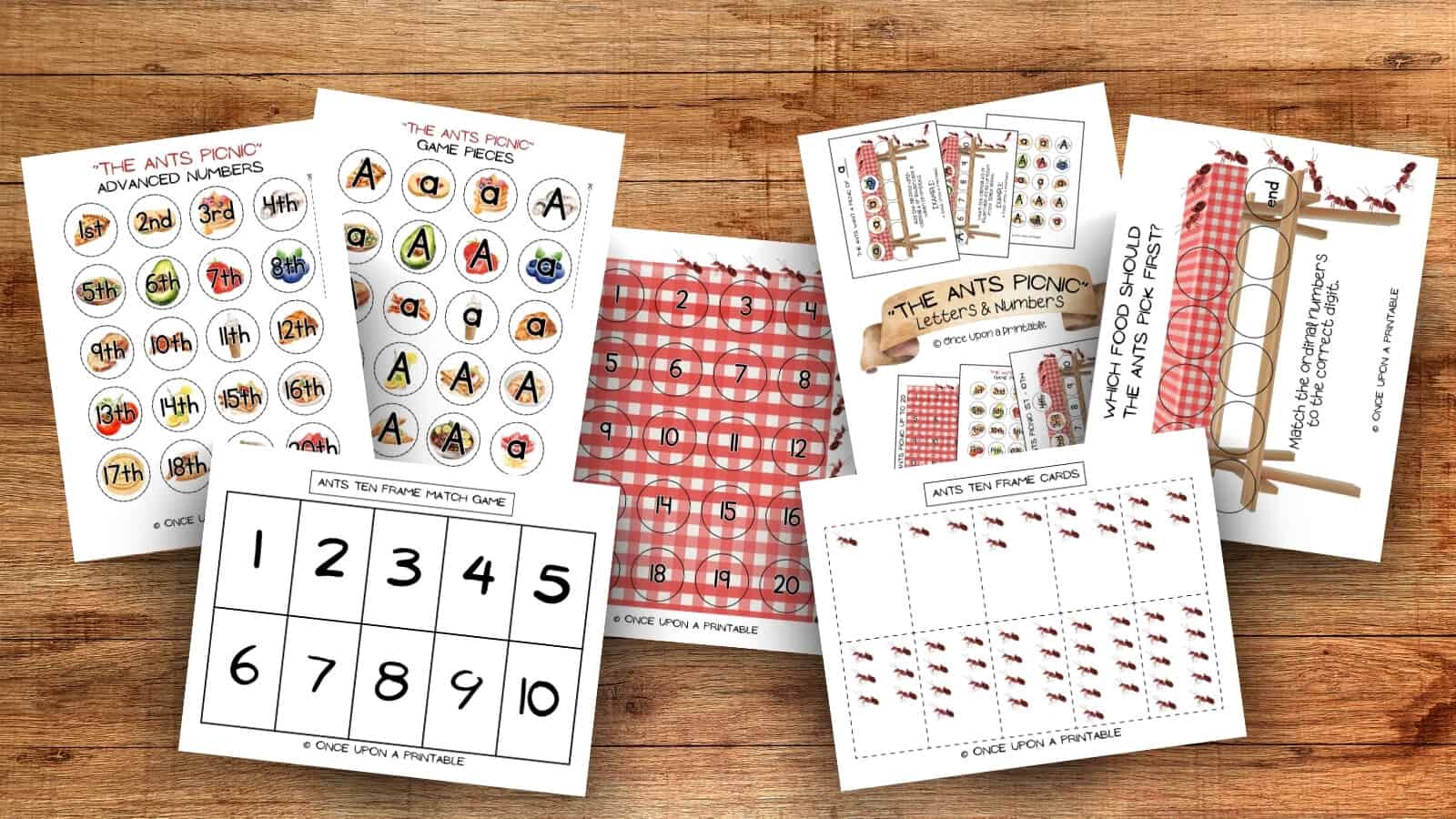 Letter A Ants picnic games laying on a wooden table. 