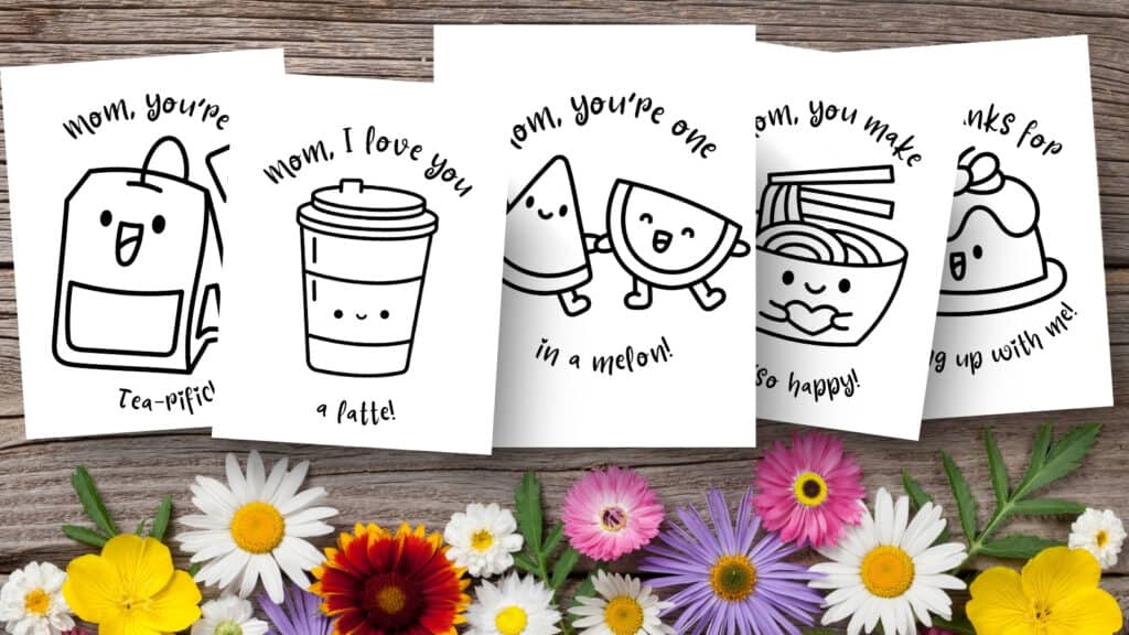 mother's day coloring cards for kids and adults, laying on a wooden table with flowers. 