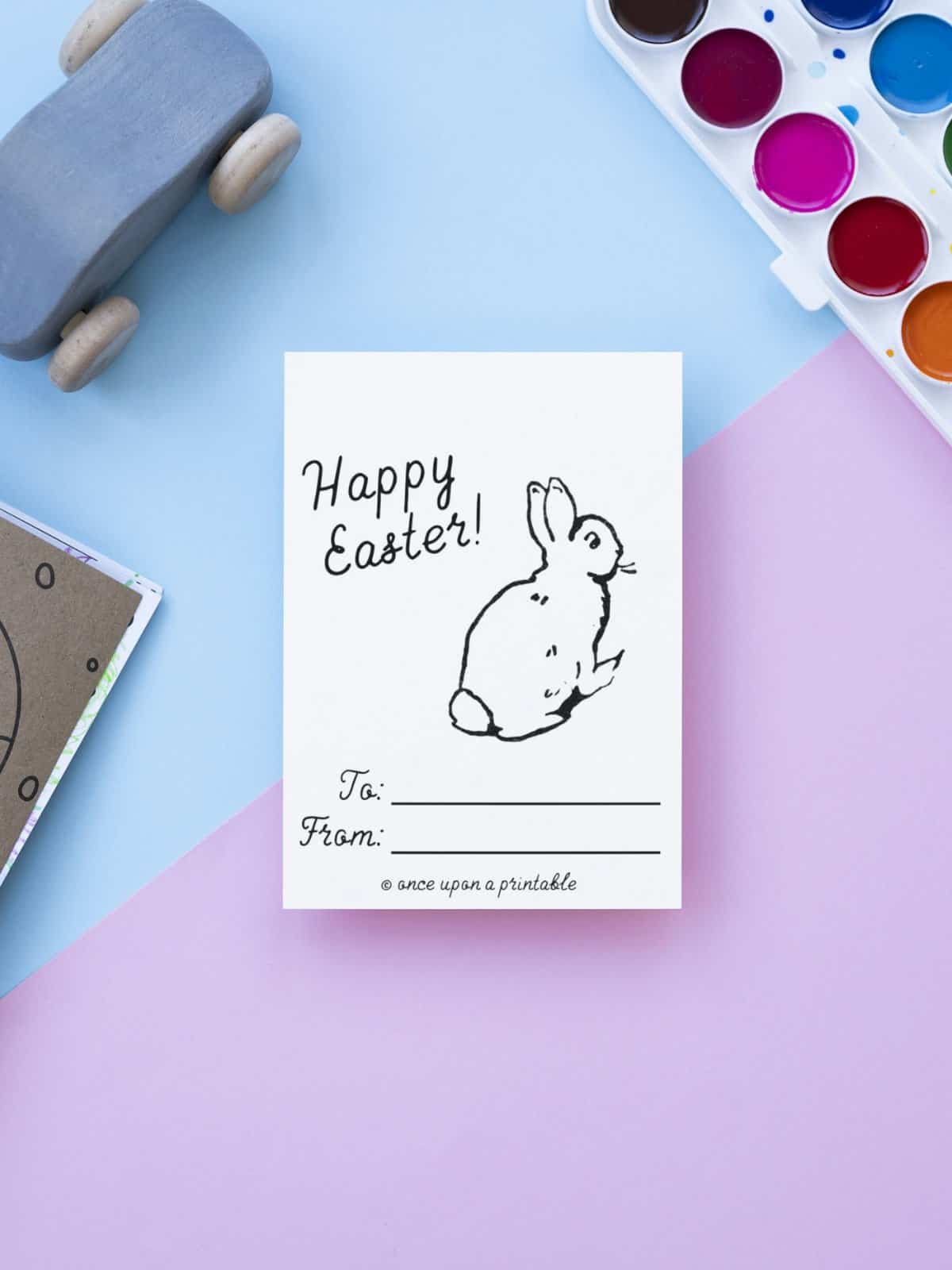 Bunny rabbit coloring card for Easter on a blue and purple background.