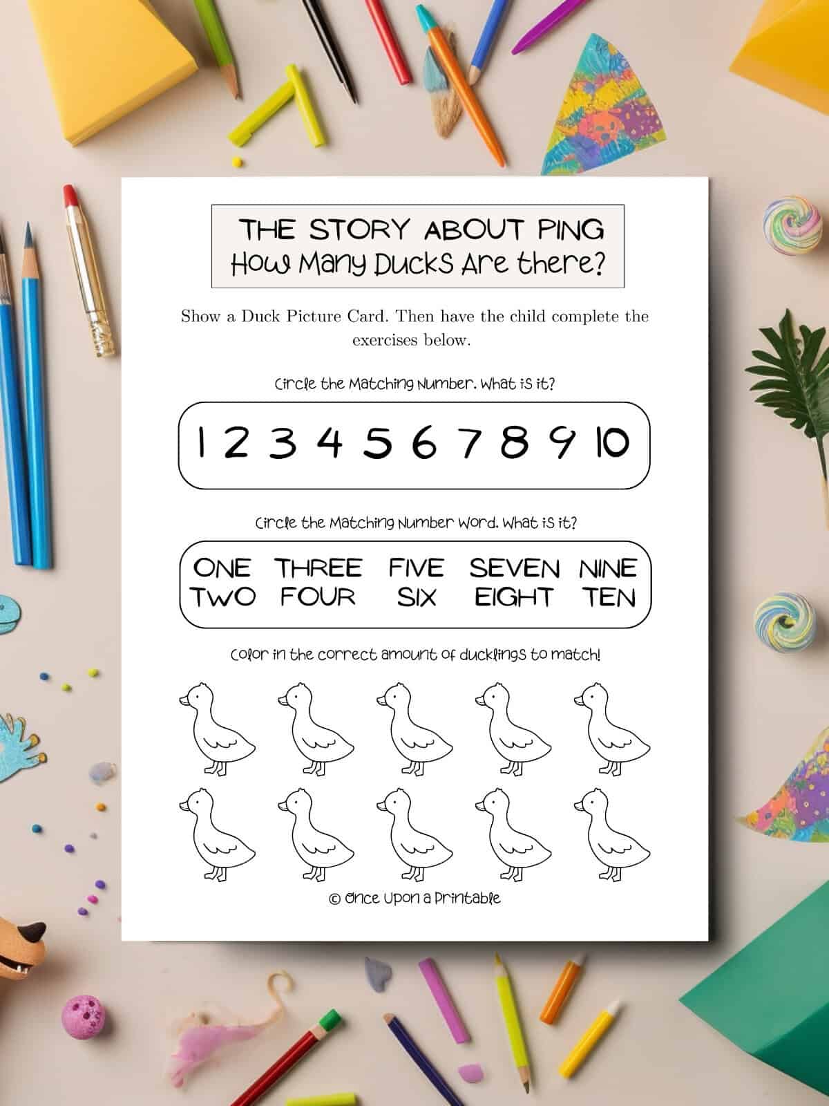 How many ducks are there, story about ping worksheet laying on a table with coloring supplies. 